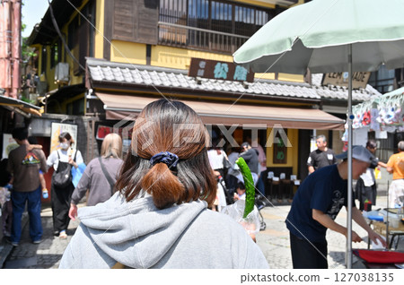 Eating out in Koedo Kawagoe: A woman eating a cucumber (Kawagoe City, Saitama Prefecture) 127038135