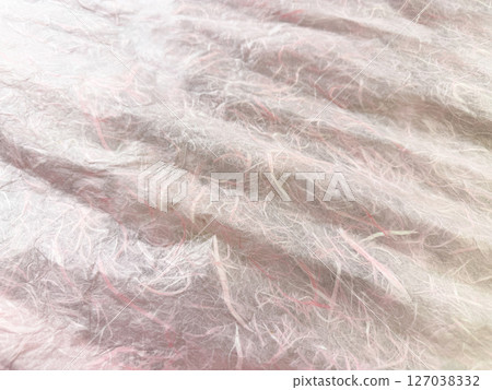Traditional Japanese paper with beautiful fibers in pink color Traditional Japanese paper with beautiful fibers in pink color 127038332