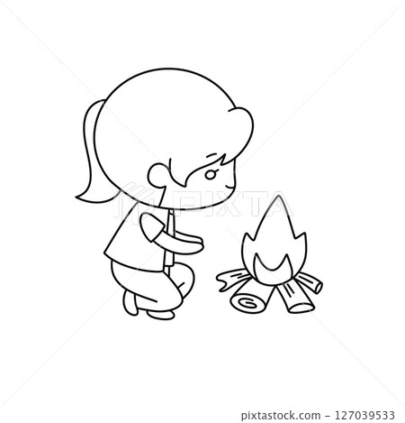 A girl is kneeling down next to a fire 127039533