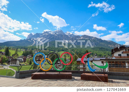 Cortina d'Ampezzo 2026 Olympic Rings with Scenic Dolomites View in Cortina d'Ampezzo, Italy. May 14, 2025 Cortina d'Ampezzo 2026 Olympic Rings with Scenic Dolomites View in Cortina d'Ampezzo, Italy. May 14, 2025 127041669