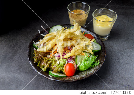 Japanese Tempura Fish Salad with Fresh Vegetables and Dressing 127043338