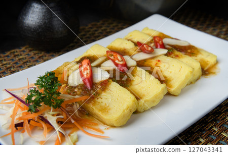 Japanese Tamago Yaki (Sweet Omelette) Topped with Spicy Sauce 127043341