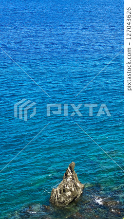 Blue sea and waves on rocks. Camiguin Island. Philippines. 127043626