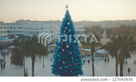 Azure Christmas Tree Dominates City Square with Festive Market a 127043656