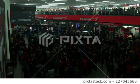 Crowded Interior View of a Multi-Level Retail Store with Red Acc 127043666