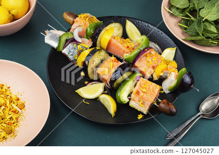 Delicious salmon skewers ready for grilling. 127045027