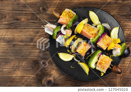 Fresh salmon skewers with vegetables. 127045028