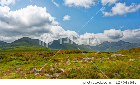Striking view of the majestic Strickeen mountain range of County Kerry, Ireland, on a sunny day. Striking view of the majestic Strickeen mountain range of County Kerry, Ireland, on a sunny day. 127045643