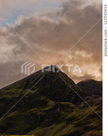 This is Carrauntoohil in Ireland at sunset. You can see the dramatic cloud formations in the sky. 127045654