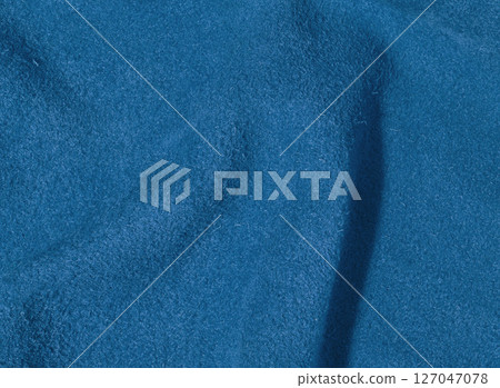 Blue suede texture with creases, fabric for bags and shoes Blue suede texture with creases, fabric for bags and shoes 127047078