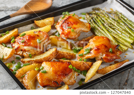 Sheet pan chicken with asparagus and potatoes close-up. horizontal Sheet pan chicken with asparagus and potatoes close-up. horizontal 127047840