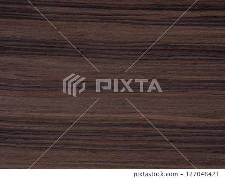 Deep charcoal and onyx striations flow over the ebony veneer, presenting a portrait of dark, natural allure Deep charcoal and onyx striations flow over the ebony veneer, presenting a portrait of dark, natural allure 127048421