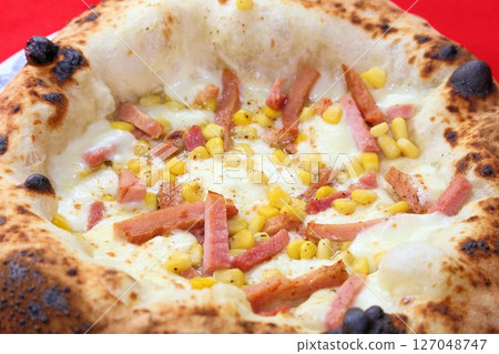 Delicious takeaway Italian food with chewy dough Authentic Neapolitan pizza Delicious takeaway Italian food with chewy dough Authentic Neapolitan pizza 127048747