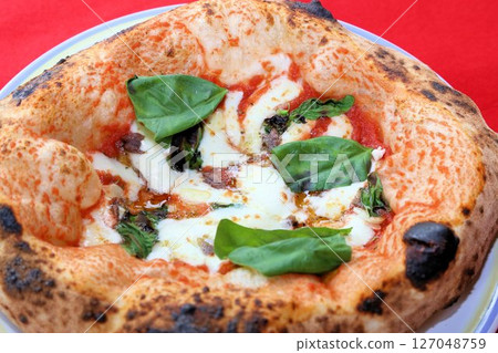 Delicious takeaway Italian food with chewy dough Authentic Neapolitan pizza Delicious takeaway Italian food with chewy dough Authentic Neapolitan pizza 127048759