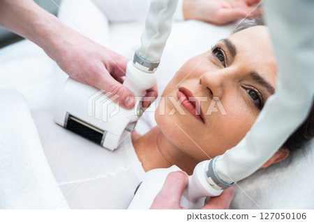 Relaxing facial treatment in a modern spa setting during the day Relaxing facial treatment in a modern spa setting during the day 127050106