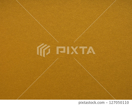 Rich mustard yellow brings warmth and texture to this vibrant paper background, inspiring creativity and energy 127050110