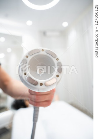 Device used for skin treatment in a modern spa during daylight hours 127050129