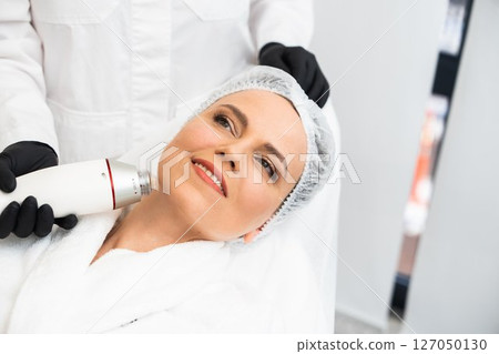 Skincare treatment session at a beauty clinic in a serene environment 127050130