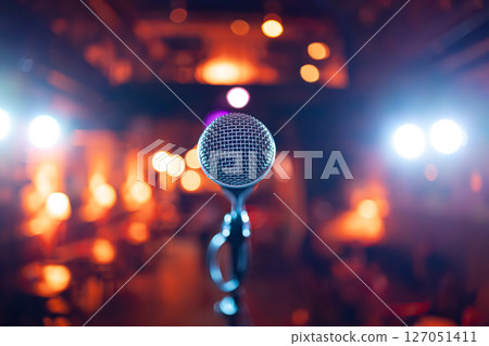 Microphone on stage against a background of auditorium. 127051411