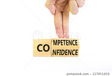 Competence and confidence symbol. Concept word Competence Confidence on wooden cubes. Businessman hand. Beautiful white table white background. Business competence confidence concept. Copy space. 127051859