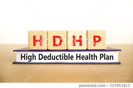 HDHP High Deductible Health Plan symbol. Concept word HDHP High Deductible Health Plan on beautiful blocks. Beautiful white background. Business HDHP High Deductible Health Plan concept. Copy space. 127051923