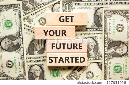 Get your future started symbol. Concept words Get your future started on beautiful wooden blocks. Beautiful background from dollar bills. Business get your future started concept. Copy space. Get your future started symbol. Concept words Get your future started on beautiful wooden blocks. Beautiful background from dollar bills. Business get your future started concept. Copy space. 127051936