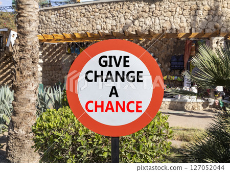 Give change a chance symbol. Concept words phrase Give change a chance on beautiful road sign. Beautiful palm tree background. Business Give change a chance concept. Copy space. Give change a chance symbol. Concept words phrase Give change a chance on beautiful road sign. Beautiful palm tree background. Business Give change a chance concept. Copy space. 127052044