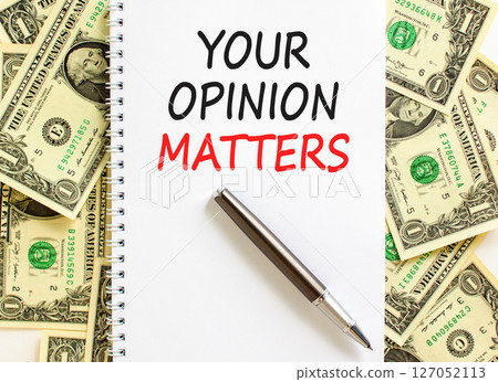 Your opinion matters symbol. Concept words Your opinion matters on beautiful white note. Beautiful background from dollar bills. Black pen. Business your opinion matters concept. Copy space. 127052113
