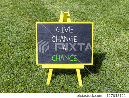 Give change a chance symbol. Concept words phrase Give change a chance on beautiful black blackboard. Beautiful green grass lawn background. Business Give change a chance concept. Copy space. Give change a chance symbol. Concept words phrase Give change a chance on beautiful black blackboard. Beautiful green grass lawn background. Business Give change a chance concept. Copy space. 127052121