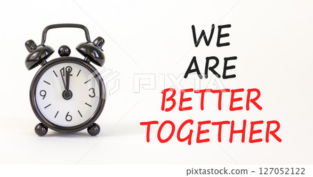 We are better together symbol. Concept words phrase We are better together on beautiful white paper. Black alarm clock. Beautiful white background. Business We are better together concept. Copy space. We are better together symbol. Concept words phrase We are better together on beautiful white paper. Black alarm clock. Beautiful white background. Business We are better together concept. Copy space. 127052122