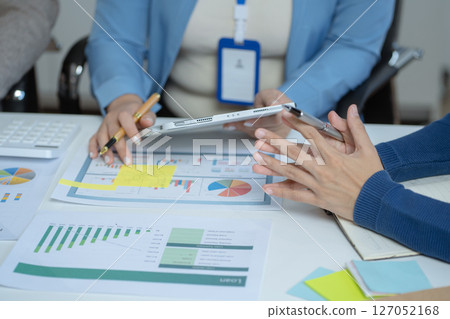 Business team present. professional investor working new start up project. tablet laptop computer with digital marketing media in design Finance managers meeting. Business team present. professional investor working new start up project. tablet laptop computer with digital marketing media in design Finance managers meeting. 127052168