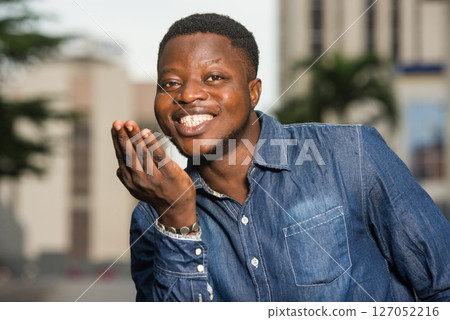 close up of young african man, happy. 127052216