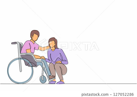 Single one line drawing young woman kneeling before man in wheelchair. Disabled husband sitting in wheelchair holding wife head in hospital ward. Continuous line design graphic vector illustration 127052286