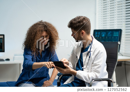 Doctor use a service fee calculator to save money on health insurance, drug cost concept. Doctor use a service fee calculator to save money on health insurance, drug cost concept. 127052562