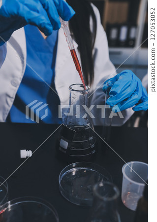 scientist working at the laboratory scientist working at the laboratory 127053052
