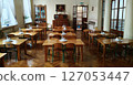 Kyiv, Ukraine March 4, 2025: Interior of a dining room in a kindergarten from the 1960-1970s with furniture, a chest of drawers and a painting in a classical style. 127053447