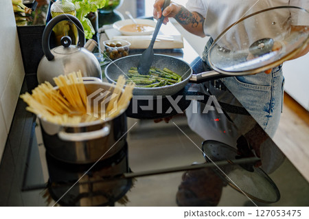 Enjoying Delicious Home Cooking The Art of Preparing Pasta and Fresh Vegetables Enjoying Delicious Home Cooking The Art of Preparing Pasta and Fresh Vegetables 127053475