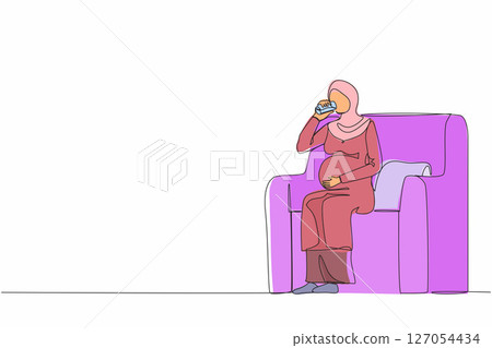 Single one line drawing Arabian pregnant woman drinking water sitting on sofa. Expectant lady have rest at home with glass. Pregnancy, healthcare, thirst concept. Continuous line design graphic vector 127054434