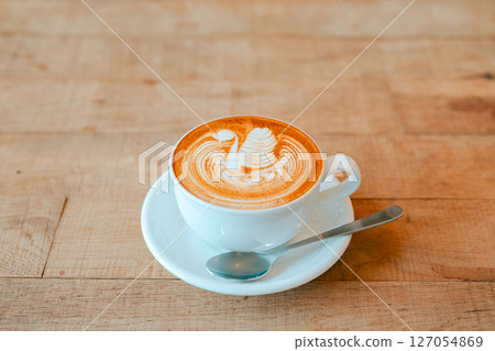 A cafe latte with beautiful swan latte art A cafe latte with beautiful swan latte art 127054869
