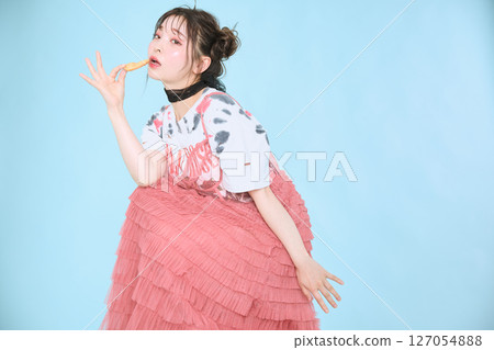 A young woman dressed in pop fashion A young woman dressed in pop fashion 127054888