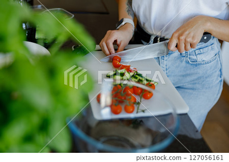 Preparation of Fresh Ingredients in a Modern, WellEquipped Kitchen for Culinary Delights 127056161