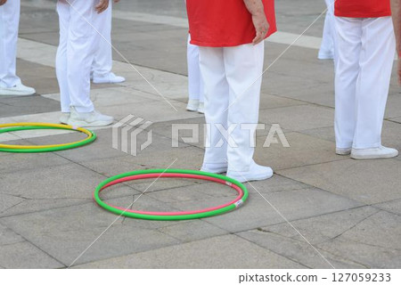 Senior Women Standing for Hoop Exercise Routine 127059233