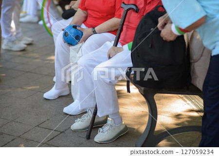 Senior Women Rest with Handball and Cane in Park Senior Women Rest with Handball and Cane in Park 127059234
