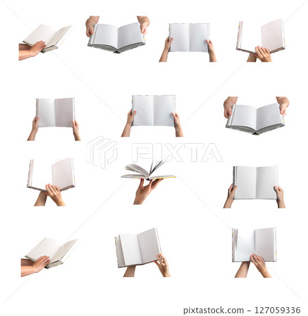 Open book held in hand, blank pages showcasing a mockup for educational or publication purposes. 127059336