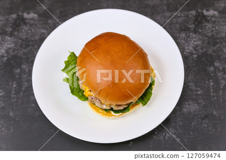 Homemade hamburgers on a plate Homemade hamburgers on a plate 127059474