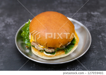 Homemade hamburgers on a plate 127059481