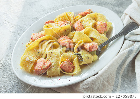 papardelle pasta, in creamy sauce with salmon, homemade, on a gray background, no people, papardelle pasta, in creamy sauce with salmon, homemade, on a gray background, no people, 127059875