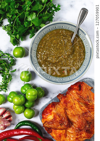 Tkemali sauce, made from green cherry plum, with ingredients on the table, tobacco chicken, top view, Georgian cuisine, no people, 127059901