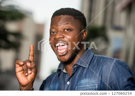 happy man with hands gesture outside happy man with hands gesture outside 127060254