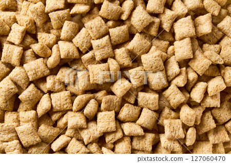 corn pads texture, close up, top view. Crispy corn pads as background. corn pads texture, close up, top view. Crispy corn pads as background. 127060470